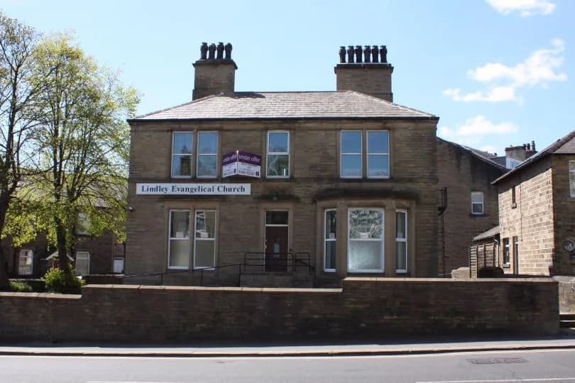 The Lindley building photographed before The Eden Foundation acquired it, still carrying its original 'for sale' signage and 'Lindley Evangelical Church' frontage.